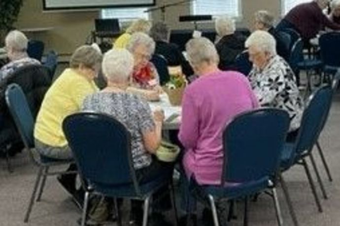 ladies group around a table