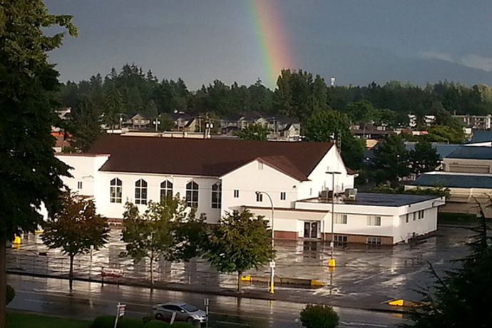 Clearbrook Church with a rainbow in background