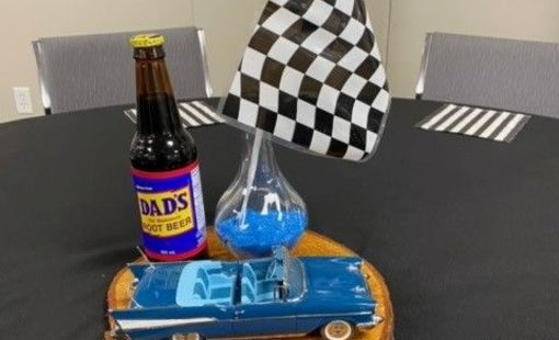 Father's Day centrepiece of checkered flag, Dad's rootbeer beverage and classic car